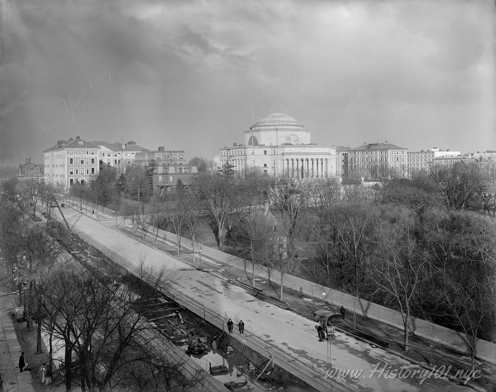 Explore the historic snapshot of NYC's IRT subway beginnings at Broadway and 116th, marking a monumental shift in urban connectivity and landscape near Columbia University