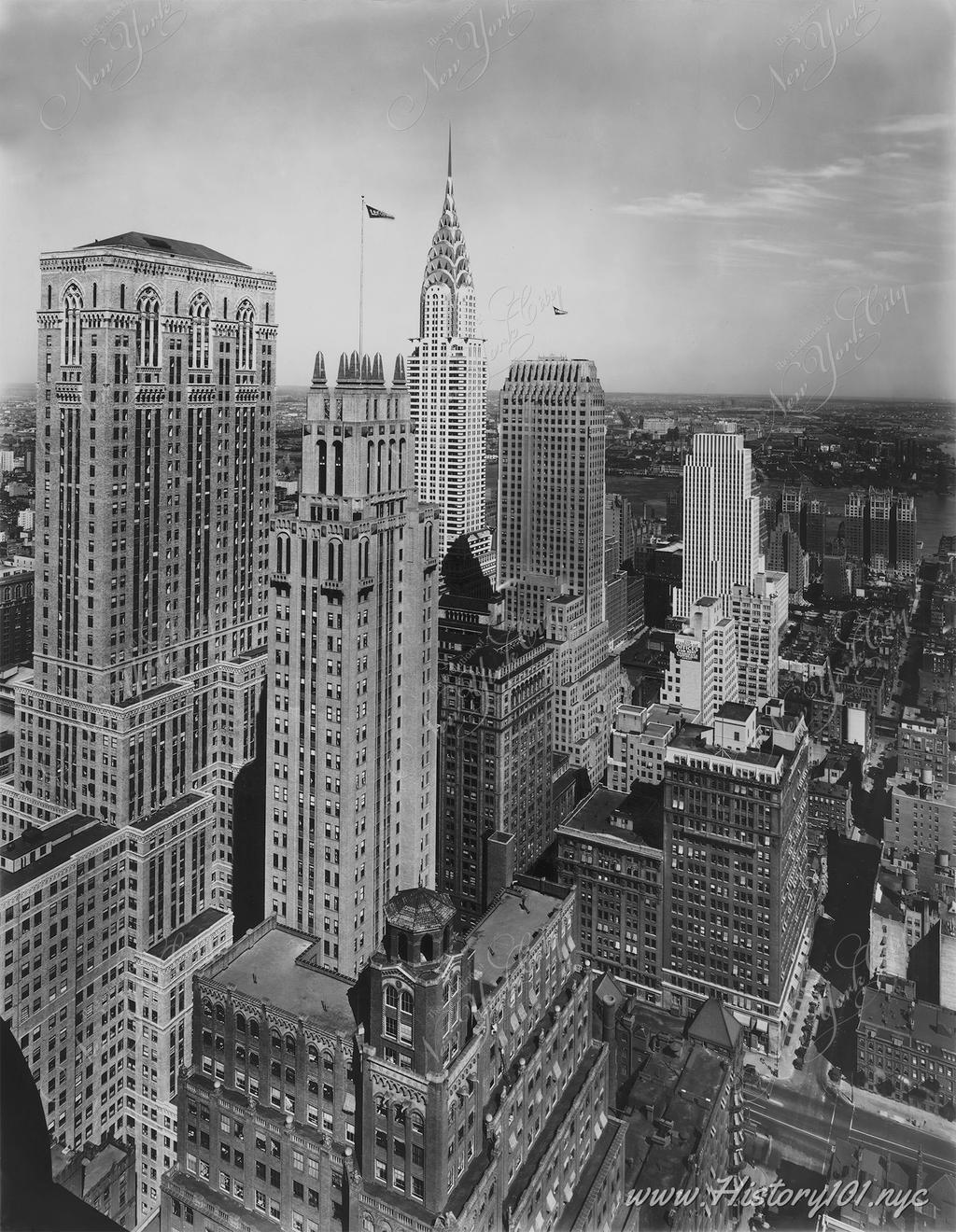 Aerial photograph of Midtown Manhattan with the Chrysler Building as the focal point. 