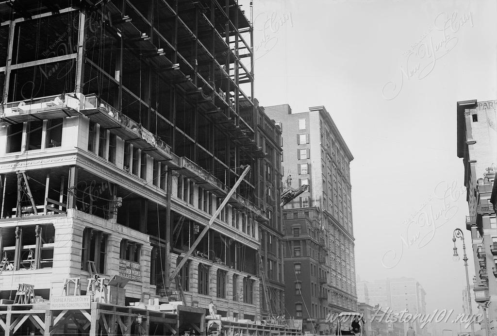 Construction worker perched 5 stories above the ground during the construction of a new building at Union Square.